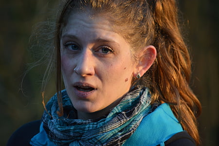 woman in teal plaid scarf thumbnail