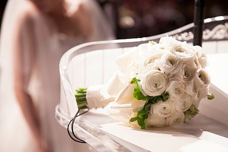 white rose bouquet on white table thumbnail