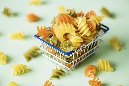 selective focus photography of pasta in gray metal basket thumbnail