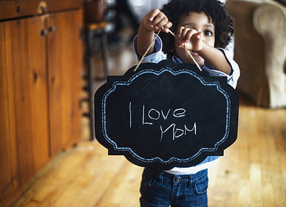 Toddler With Sign For Mom Photo thumbnail