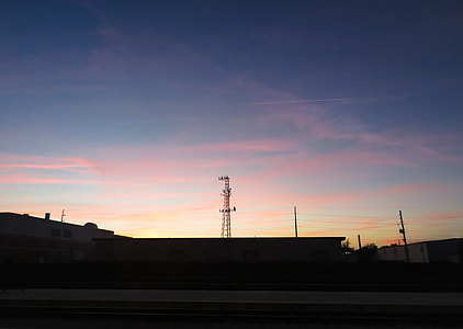 silhouette of electric tower at golden hor thumbnail