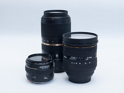 three assorted black camera lenses thumbnail
