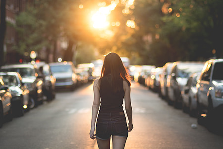 A woman walks on the street in New York City thumbnail