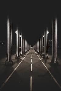 empty asphalt roadway during nighttime thumbnail