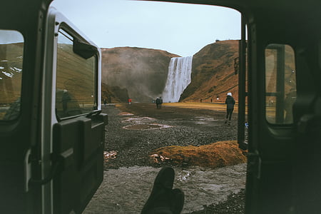 people near waterfalls at daytime thumbnail