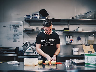 man preparing food on island countertop thumbnail