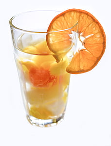 fruit juice in clear pint glass with slice orange thumbnail