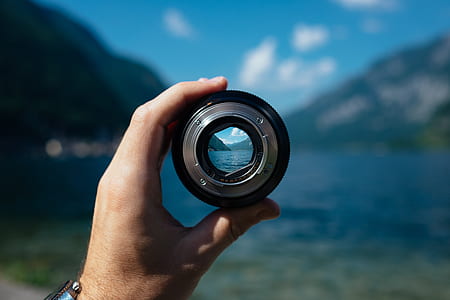 person holding scope in front body of water thumbnail