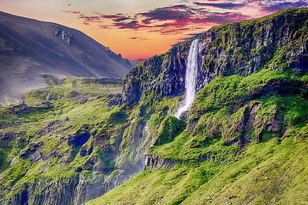 landscape photography of green mountain during daytime thumbnail