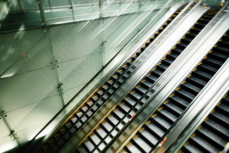 four gray escalators thumbnail