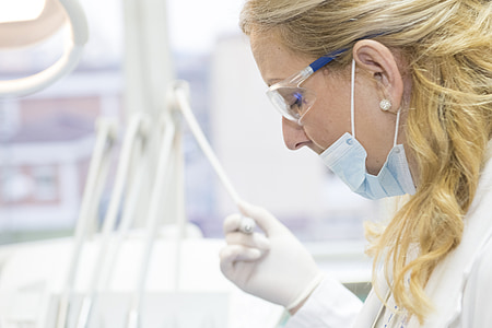 woman wearing face mask and rubber gloves thumbnail