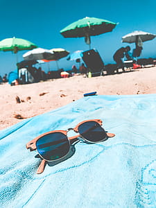 Brown Clubmaster Sunglasses on Blue Towel thumbnail