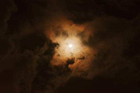 white clouds covered moon at night thumbnail