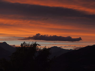 silhouette of mountain gray and orange sky at sunset thumbnail