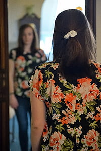 woman standing in front of mirror thumbnail