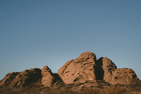 rock formation under blue sky thumbnail