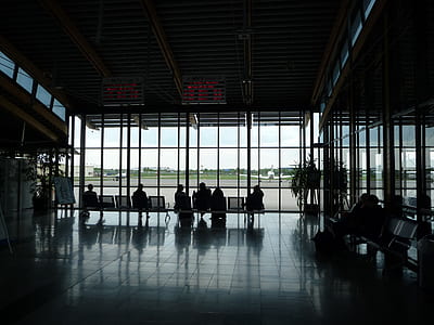 silhouette photo of people sitting at the lobby thumbnail