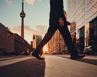 person walking on concrete road thumbnail