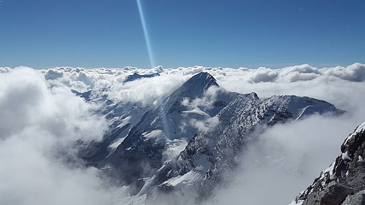 photo of foggy and snowcovered mountain thumbnail