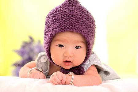 baby wearing purple knitted chulo and gray top thumbnail