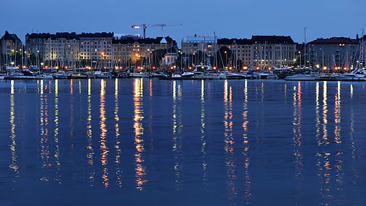 photo of boat docked near building thumbnail