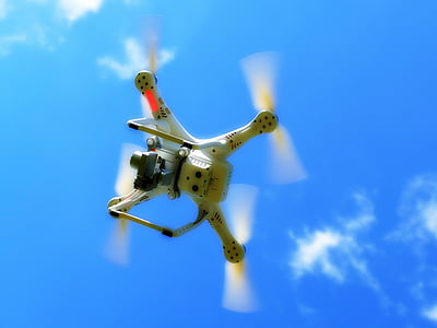 white quadcopter on sky thumbnail
