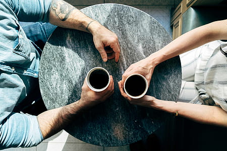 man and woman taking their coffee thumbnail