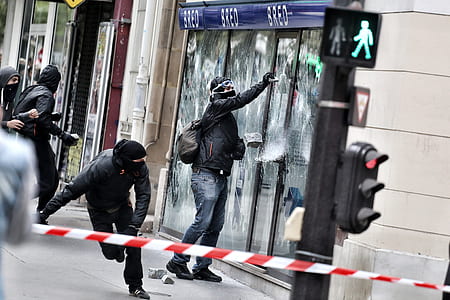 man standing beside glass door thumbnail