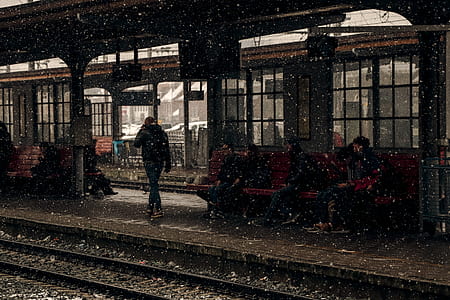 person walking near train rail thumbnail