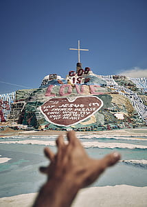 multicolored cross figurine thumbnail