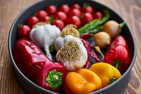 assorted-color vegetables in round black pan thumbnail