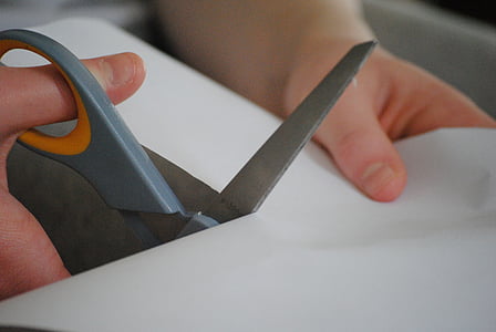 person cutting the paper thumbnail