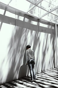 person leaning at wall during daytime thumbnail