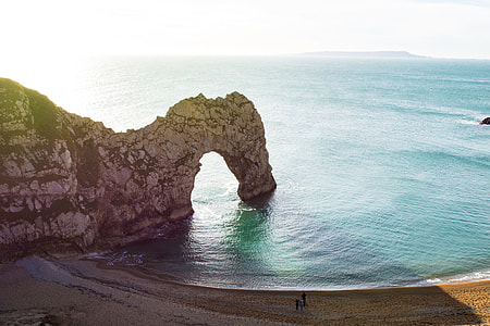 rock formation on body of water thumbnail