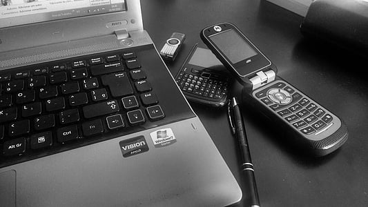 laptop beside flip phone thumbnail