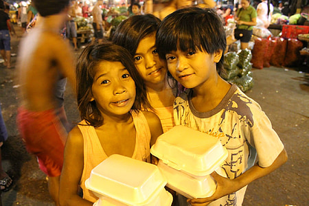boy and girl holding closed packing packs thumbnail