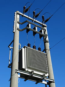 gray electric post under blue sky thumbnail