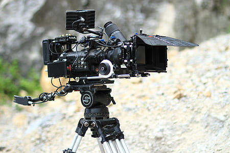 black video camera on tripod stand thumbnail