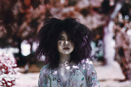 woman in gray and multicolored floral blouse during daytime thumbnail