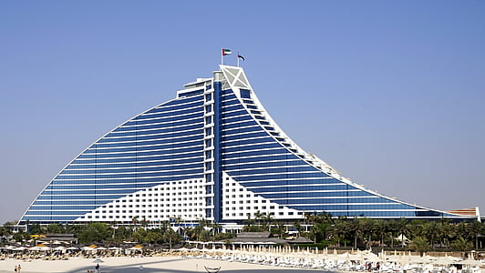 blue and white high-rise building under blue sky thumbnail