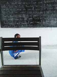 girl student docking in front of chalk board thumbnail