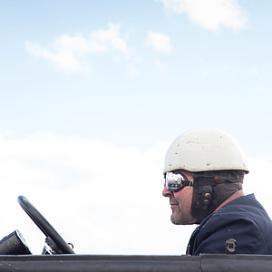 man driving vehicle thumbnail