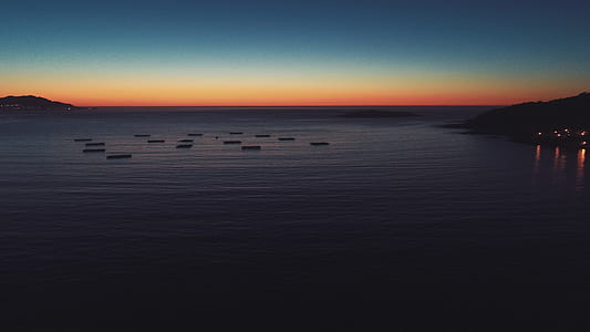 body of water during golden hour thumbnail
