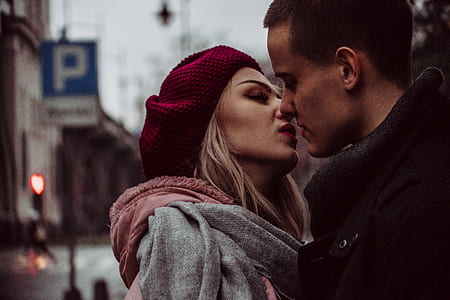 selective focus photography of kissing man and woman thumbnail
