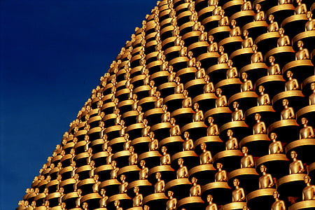 close up photography of gold statue building thumbnail