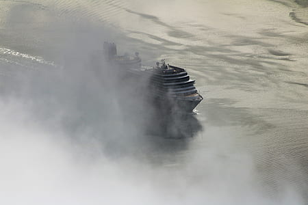 black cruise ship on body of water thumbnail
