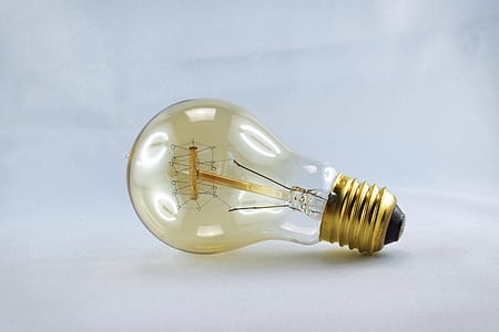 turned-off light bulb on white surface thumbnail