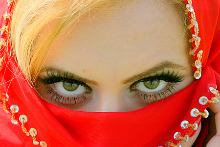 woman covering her face with red textile thumbnail