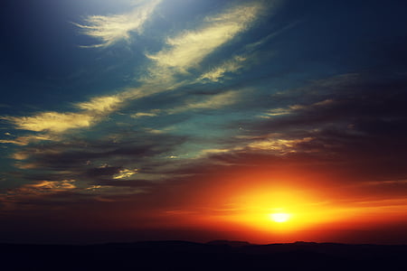sunset over horizon portrait thumbnail