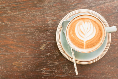 cafe latte on teacup with spoon thumbnail